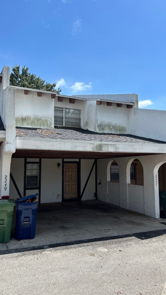 Weathered home exterior showing need for prep and repair before painting